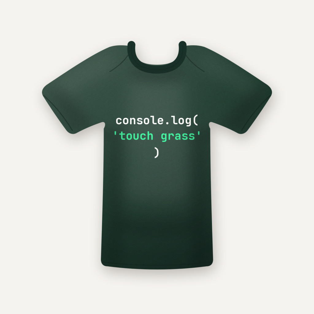 console.log('touch grass') tee in forest green, flat lay